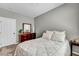 Serene bedroom featuring soft gray walls, a cozy queen bed, and neutral carpet at 11908 Menchaca Ln, Las Vegas, NV 89138