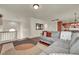 Open-concept living area with a comfortable L-shaped couch and access to the kitchen at 11908 Menchaca Ln, Las Vegas, NV 89138