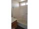 Bright bathroom featuring a tub and shower combination with neutral tile surround at 1236 Dusty Creek St, Las Vegas, NV 89128