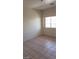 Neutral bedroom featuring tiled flooring and a window at 1236 Dusty Creek St, Las Vegas, NV 89128