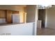 Open floor plan of dining room and kitchen with breakfast bar, wooden cabinets, and tile floors at 1236 Dusty Creek St, Las Vegas, NV 89128