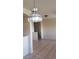 View of dining room with overhead light fixture, tile flooring and stairs to upper level at 1236 Dusty Creek St, Las Vegas, NV 89128
