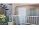 Entrance to condo featuring white door, security gate, and neutral paint scheme at 1236 Dusty Creek St, Las Vegas, NV 89128