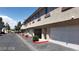 Attractive condo exteriors with individual garages and neatly maintained landscaping at 1236 Dusty Creek St, Las Vegas, NV 89128