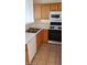 Functional kitchen featuring wood cabinetry and appliances at 1236 Dusty Creek St, Las Vegas, NV 89128