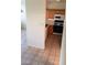 Compact kitchen featuring wood cabinets, essential appliances and tiled floor at 1236 Dusty Creek St, Las Vegas, NV 89128