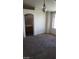 Living room with neutral walls, carpeted floors, and natural light, offering a comfortable and welcoming ambiance at 1236 Dusty Creek St, Las Vegas, NV 89128