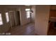 Open living room features tile flooring, neutral walls and bright windows for comfortable living at 1236 Dusty Creek St, Las Vegas, NV 89128