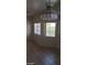 Bright living space with tiled flooring and two windows at 1236 Dusty Creek St, Las Vegas, NV 89128