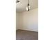 Neutral room with light fixture, providing a blank canvas for personalization at 1236 Dusty Creek St, Las Vegas, NV 89128
