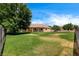 Large grassy backyard with a covered patio, perfect for entertaining or relaxation at 12780 Davis Wright Ct, Henderson, NV 89044