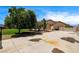 Long driveway with mature landscaping leading to a home in a residential neighborhood at 12780 Davis Wright Ct, Henderson, NV 89044