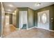 Home foyer with tile flooring, neutral paint, a white front door and modern lighting at 12780 Davis Wright Ct, Henderson, NV 89044