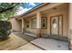 Welcoming front porch with decorative stone pillars and a beautiful front door at 12780 Davis Wright Ct, Henderson, NV 89044