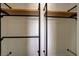 Close up of a functional walk-in closet with custom shelving and metal bars at 12780 Davis Wright Ct, Henderson, NV 89044