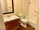 Functional bathroom featuring a shower-tub combo, toilet and vanity with new hardware at 1316 Capri Dr # Abc&D, Boulder City, NV 89005