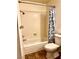 Cozy bathroom featuring a shower-tub combo, patterned shower curtain, and classic fixtures at 1316 Capri Dr # Abc&D, Boulder City, NV 89005