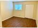 Cozy bedroom with laminate wood floors, a window, and a closet perfect for relaxation at 1316 Capri Dr # Abc&D, Boulder City, NV 89005