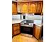 Well-equipped kitchen featuring wood cabinets, stainless steel oven, and countertops at 1316 Capri Dr # Abc&D, Boulder City, NV 89005