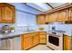 Well-lit kitchen featuring updated countertops, cabinets and appliances for modern living at 1316 Capri Dr # Abc&D, Boulder City, NV 89005