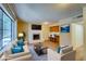 Inviting living room with large windows, a cozy fireplace, and comfortable seating, perfect for relaxation at 1316 Capri Dr # Abc&D, Boulder City, NV 89005