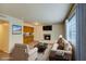 Bright living room featuring a fireplace, comfortable seating, and neutral decor creating a welcoming atmosphere at 1316 Capri Dr # Abc&D, Boulder City, NV 89005