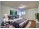 Comfortable main bedroom with a well-lit window, soft carpet, and a calming color palette for relaxation at 1316 Capri Dr # Abc&D, Boulder City, NV 89005