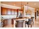 Chic bar area with custom cabinetry, granite countertops, and comfortable seating at 15 Via Mantova # 401, Henderson, NV 89011