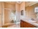 Beautiful bathroom features a tiled shower with glass doors and a single sink vanity at 15 Via Mantova # 401, Henderson, NV 89011