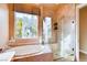 Bright bathroom features a soaking tub with jets and a separate glass-enclosed shower at 15 Via Mantova # 401, Henderson, NV 89011