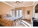 Comfortable bedroom featuring balcony access with double doors and decorative furniture at 15 Via Mantova # 401, Henderson, NV 89011