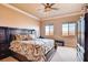 Comfortable bedroom with neutral walls, crown moulding, and large window with views at 15 Via Mantova # 401, Henderson, NV 89011
