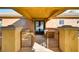 Inviting front porch with seating area, decorative iron gates, and a stylish entrance at 15 Via Mantova # 401, Henderson, NV 89011