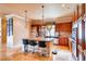 Gourmet kitchen featuring stainless steel appliances, large island with seating, and warm wood cabinetry at 15 Via Mantova # 401, Henderson, NV 89011