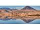 Scenic lake view with mountain background, reflecting the sky and landscape in the calm water at 15 Via Mantova # 401, Henderson, NV 89011