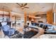 Elegant living room featuring a large sectional sofa, stylish decor, and an open floor plan at 15 Via Mantova # 401, Henderson, NV 89011