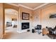 Home office showcasing a cozy fireplace conveniently located near the primary bedroom at 15 Via Mantova # 401, Henderson, NV 89011