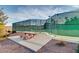 Outdoor tennis court with a picnic table on the grounds at 15 Via Mantova # 401, Henderson, NV 89011