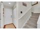 Inviting entryway with a white front door, coat closet, and staircase leading to the upper level of the home at 1825 Derbyshire Dr, Las Vegas, NV 89117