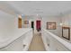 Upstairs hallway with carpet, white railings, neutral walls, lighting and decorative wall decor at 1825 Derbyshire Dr, Las Vegas, NV 89117