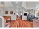 Cozy living room with hardwood floors, providing an inviting space for relaxation and entertainment at 1825 Derbyshire Dr, Las Vegas, NV 89117