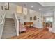 Spacious living room features hardwood floors, a staircase, and an open design at 1825 Derbyshire Dr, Las Vegas, NV 89117