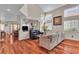 Bright living room with vaulted ceilings, hardwood floors, and ample natural light from the large windows at 1825 Derbyshire Dr, Las Vegas, NV 89117
