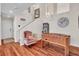 Open concept living room with hardwood floors, staircase, and game area at 1825 Derbyshire Dr, Las Vegas, NV 89117