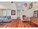Hardwood floors throughout the living room highlight the staircase, foosball table, and comfortable seating at 1825 Derbyshire Dr, Las Vegas, NV 89117