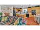 Bright, open-concept living and kitchen area with hardwood floors and lots of natural light at 1825 Derbyshire Dr, Las Vegas, NV 89117