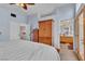 Bright main bedroom with a view to a bathroom, hardwood floors, and stylish design at 1825 Derbyshire Dr, Las Vegas, NV 89117