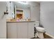 Functional bathroom featuring a single sink vanity, a standard toilet, and white walls at 2454 Paradise Village Way, Las Vegas, NV 89120
