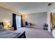 Carpeted bedroom with an office desk, a queen bed, and a sliding door leads to the outside at 2454 Paradise Village Way, Las Vegas, NV 89120