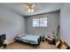 Bedroom with a single bed, window, neutral walls, and carpet flooring; filled with personal items at 2454 Paradise Village Way, Las Vegas, NV 89120